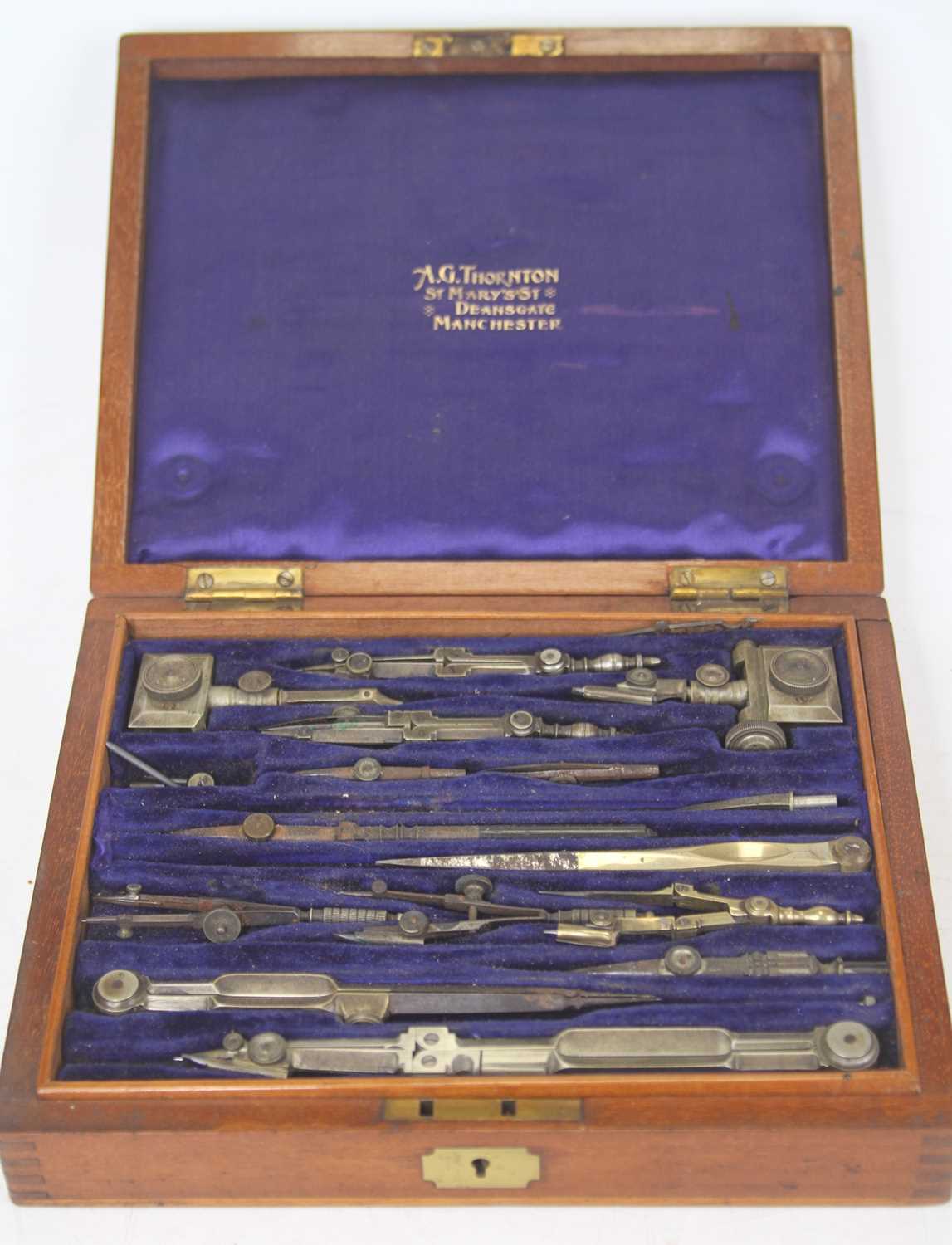 A 19th century cased set of drawing instruments, in fitted satinwood box, bearing the name AG