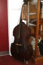 A double bass with bow, h.195cm (a/f) Condition very poor.