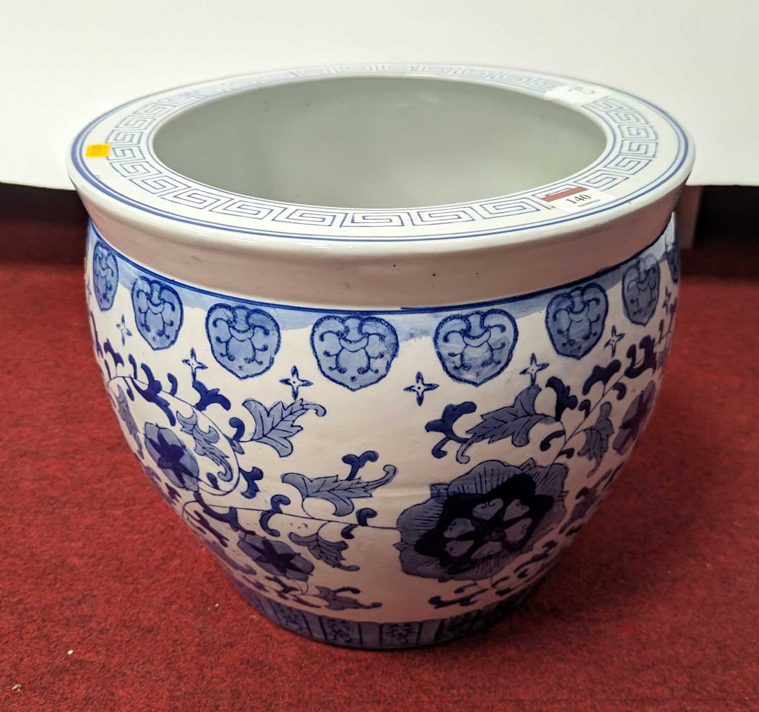 A Chinese blue & white porcelain jardiniere, decorated with flowers, height 31cm