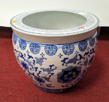 A Chinese blue & white porcelain jardiniere, decorated with flowers, height 31cm