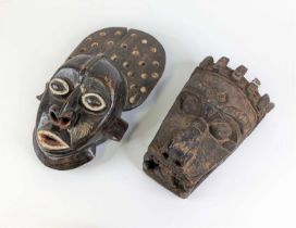 An African carved hardwood tribal mask, h.48cm; together with another