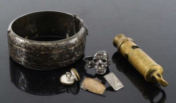 A collection of miscellaneous items to include a mid-20th century silver hinged bangle with