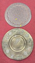 An Indian copper tray, decorated in high relief with floral roundels and hunting scenes, with