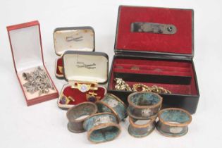 A collection of items to include a set of six bronzed metal napkin rings, gentleman's cufflinks, and
