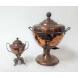 A 19th century copper samovar, h.41cm; together with another smaller, h.23cm (2)