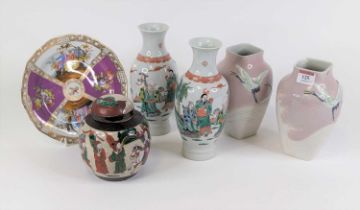 A pair of 20th century Japanese porcelain vases, each decorated in relief with cranes, bearing