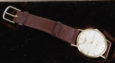 A vintage gent's Longines 9ct gold cased manual wind wristwatch, having a signed silvered dial,