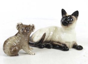 A Beswick model of a Siamese cat, No. 1559, h.12cm; together with another of a koala-bear Both