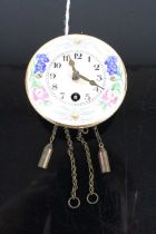 A Wintermantel pendulette miniature wall clock, having an enamel decorated circular dial (lacking