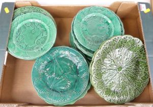 A collection of Victorian and later green glazed majolica plates