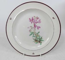 A Davenport creamware plate, 19th century, hand-painted with flowers, bearing Latin name verso,