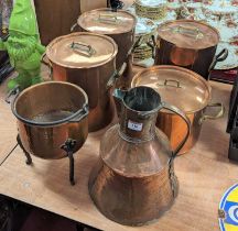 A set of three Leon Jarggi & Sons copper saucepans, flanked by cast brass handles, height 27cm,