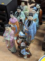 A set of 20th century Chinese pottery figures of the eight immortals, height 31cm All very grubby