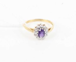 A 9ct gold, amethyst and white sapphire set flower head cluster ring, 1.8g, size O