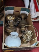 A collection of oil lamp parts