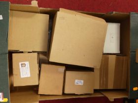 A collection of clock movments, all boxed