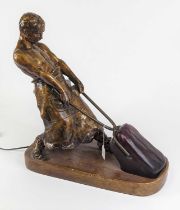 After Richard W Lange, a bronzed table lamp in the form of a blacksmith, height 52cm