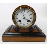A 19th century walnut and ebonised mantel clock of drum head shape, the enameled dial signed JW
