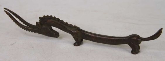 A Chinese bronzed metal figure of an antelope, length 8cm