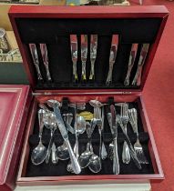A part canteen of stainless steel cutlery, in stained wooden case, w.39cm