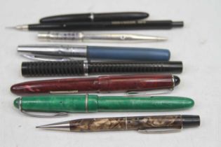 A collection of pens to include Osmiroid fountain pen having a gilt nib, and simulated malachite cap