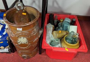 A collection of vintage stoneware and glass bottles, together with a stoneware water filter