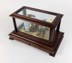 A Russell of Norwich barograph, in a glazed case, standing on further wooden base with drawer