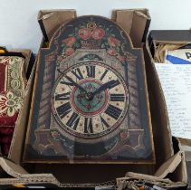 A continental style wall hanging clock, the painted dial showing Roman numerals, decorated with