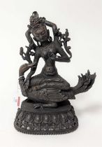 A Chinese bronzed figure of a deity, h.30cm