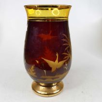 A 20th century ruby glass vase, of baluster shape, the body etched with ducks in a landscape, on