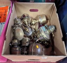 A collection of brass oil lamp burners