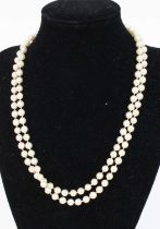 A cultured pearl single knotted string necklace, 86cm; together with a heart shaped leather ring box