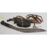 A 20th century kukri, having a curved steel blade and copper capped wooden handle, 43cm; together