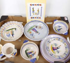 A collection of Quimper faience pottery, to include plates and porringers