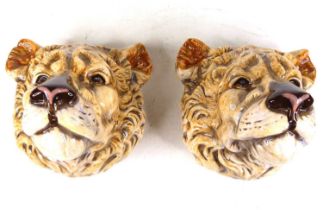 A pair of novelty wall pockets, each in the form of a lion head, w.17cm Of recent manufacture and in
