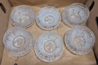A set of six cut glass bowls and saucers