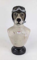 A novelty painted composite bust of a dog dressed as a racing driver, height 49cm