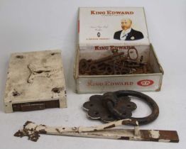 A vintage iron doorknocker, lock and keys