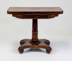 A William IV rosewood pedestal tea table, having D-shaped fold-over top with swivel action, the