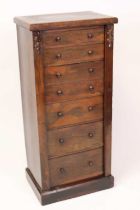 A Victorian rosewood Wellington secretaire chest arranged as seven graduated drawers with drawers