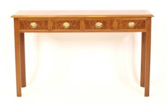 A walnut and figured walnut hall table in the Georgian style, the crossbanded top above four