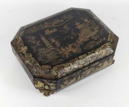 A Chinese black lacquered games box, 19th century, of octagonal form, gilt decorated with a pagoda