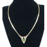 A 14ct yellow gold emerald and diamond necklace by Bellarri, featuring a pear cut emerald claw set