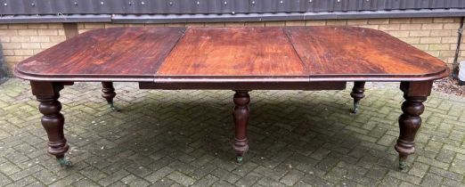 A Victorian mahogany extending dining table of large proportions, the top having a moulded edge, and