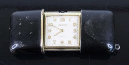 An Art Deco Movado silver and black enamel cased travelling purse watch, the square silvered dial