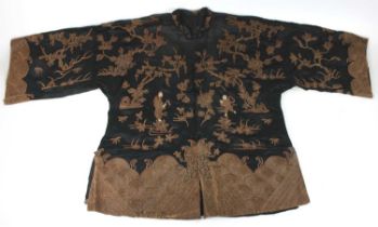 A late Qing Dynasty Chinese embroidered short robe / jacket, of black silk with applied