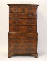 A mid-18th century figured walnut chest-on-chest, the upper section having two short and three