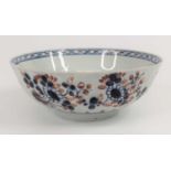 A Liverpool porcelain bowl, circa 1760, decorated with flowers in iron red and blue, dia.15cm One