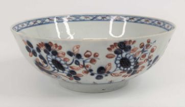 A Liverpool porcelain bowl, circa 1760, decorated with flowers in iron red and blue, dia.15cm One