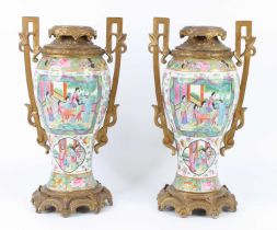 A pair of Chinese Canton porcelain vases, 19th cenury, of inverse baluster form, having European